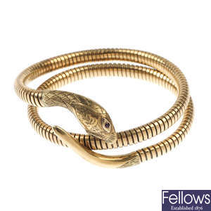 A 1960s 9ct gold ruby snake bangle.