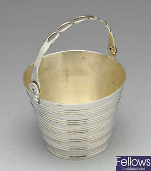 A George II silver cream pail.