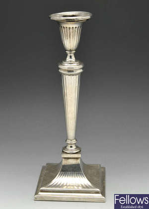 A George III silver candlestick by Matthew Boulton. 