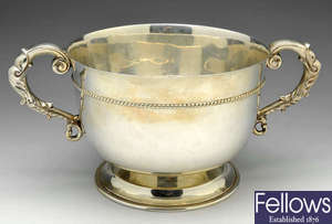 A 1920's large silver bowl with twin handles.