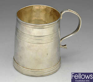 A William III silver half pint mug.
