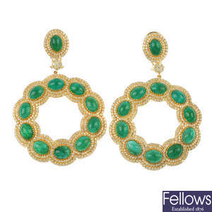 A pair of emerald and diamond ear pendants.
