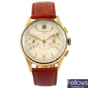 BAUME & MERCIER - a yellow metal gentleman's chronograph wrist watch.