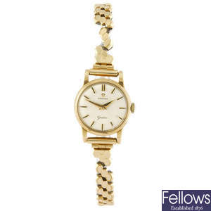 OMEGA - a lady's 9ct yellow gold Genève bracelet watch.