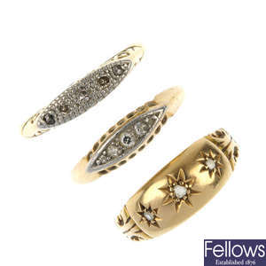 A selection of three early 20th century 18ct gold diamond rings.
