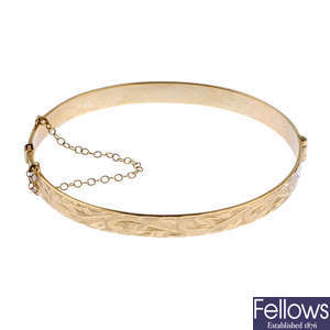 Two 9ct gold hinged bangles.