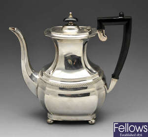 A modern silver coffee pot. 