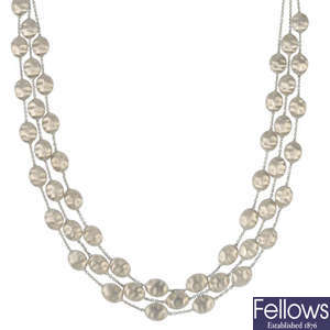 MARCO BICEGO - an 18ct gold three-row necklace.