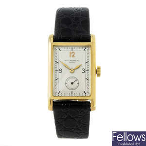 PATEK PHLIPPE - a gentleman's yellow metal wrist watch.