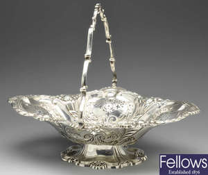 A late Victorian silver swing handled cake basket.