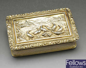 A George IV silver gilt snuff box with grouse moor scene.