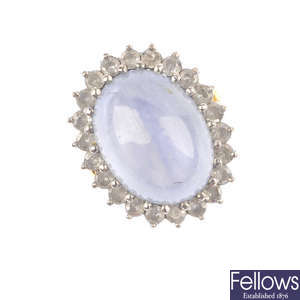 A star sapphire and diamond cluster ring.