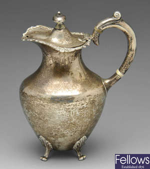 A late Victorian silver hot water jug & 1920's silver sugar bowl. (2).