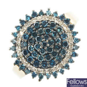 A 9ct gold colour treated 'blue' diamond and diamond cluster ring.