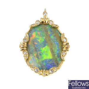 An opal and diamond pendant.