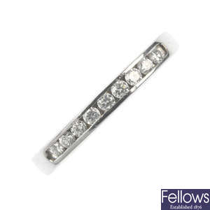 A platinum diamond half-circle eternity ring.