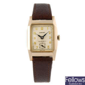 GARRARD - a gentleman's 9ct gold wrist watch. 