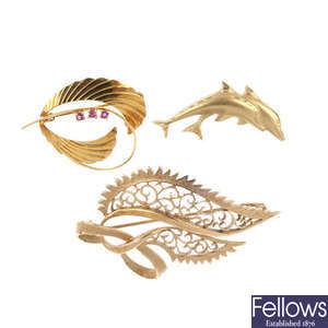 A selection of three brooches.