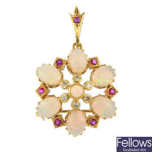 An opal, diamond and ruby floral pendant.