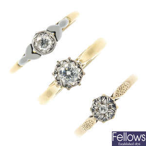 A selection of three gold diamond single-stone rings.