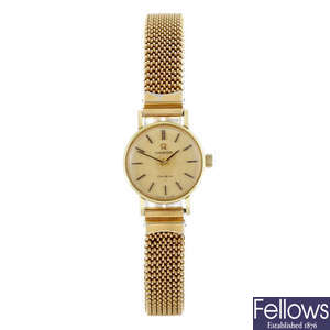 OMEGA - a lady's gold plated Genève bracelet watch.