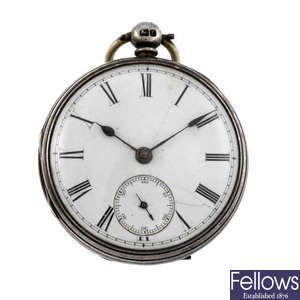 An open face silver pocket watch.