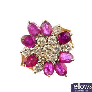 A 9ct gold ruby and diamond cluster ring. 