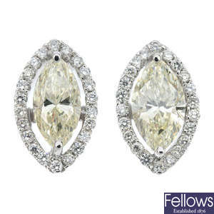 A pair of diamond and 'yellow' diamond cluster ear studs. 