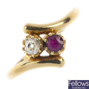 An early 20th century 18ct gold diamond and ruby two-stone crossover ring.