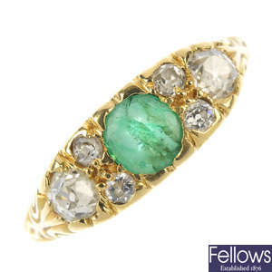 An emerald and diamond seven-stone ring.