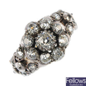 A mid 19th century silver and gold diamond cluster ring.