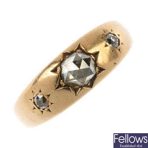 An early 20th century 18ct gold diamond three-stone ring, AF.