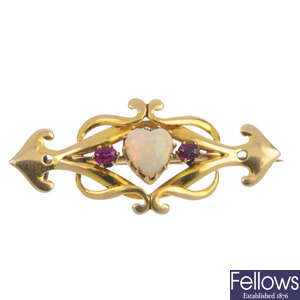An Arts & Crafts 15ct gold opal and ruby brooch.