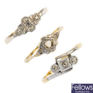 A selection of four platinum and gold diamond dress rings. 