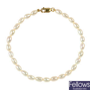 Two cultured pearl single-strand necklaces and a bracelet.