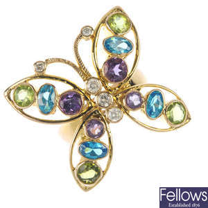 A diamond and multi-gem butterfly ring.
