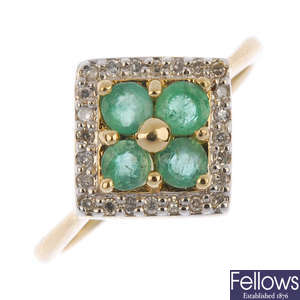 A 9ct gold emerald and diamond cluster ring. 
