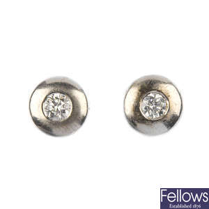 A pair of 18ct gold diamond earrings and a pair of paste ear studs.