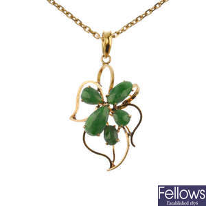 A mid 20th century gold jade floral pendant.