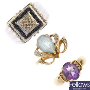 A selection of three gold gem-set rings. 