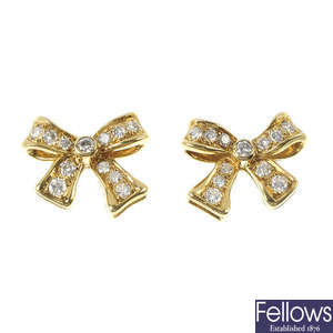 A pair of 18ct gold diamond bow ear studs.