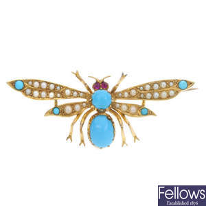 An early 20th century 15ct gold gem-set moth brooch.