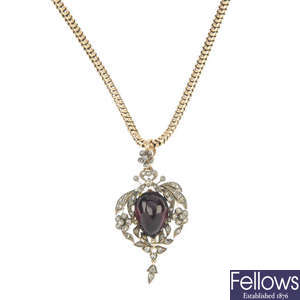 A garnet and diamond pendant.