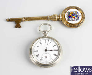 A Birmingham Transport silver-gilt and enamel presentation key, plus an Argentinean pocket watch