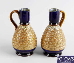 A pair of Royal Doulton ewers