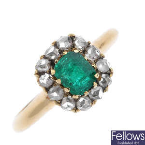 An early 20th century 18ct gold emerald and diamond cluster ring.
