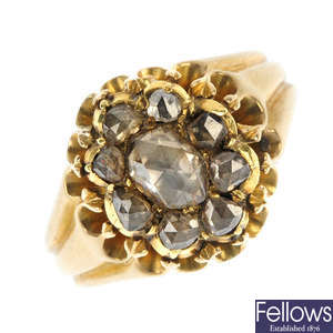 A foil-back gold diamond cluster ring.