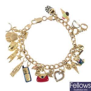 A 9ct gold charm bracelet with charms.