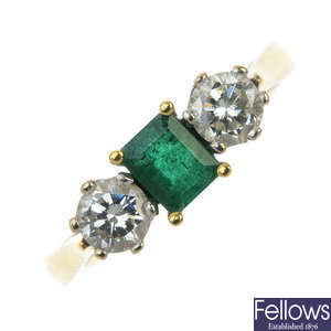 An 18ct gold diamond and emerald three-stone ring.