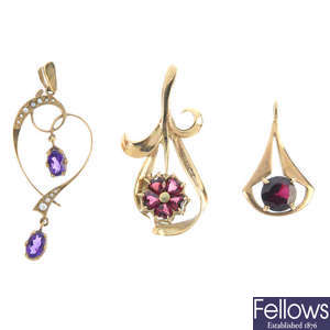 A selection of four gem-set pendants.
